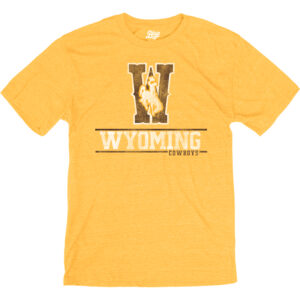 Gold short sleeve tee with large W in brown with white outline, white bucking horse with gold outline, on top of W. Wyoming in white under and cowboys at bottom.