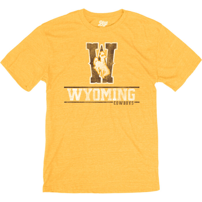 Gold short sleeve tee with large W in brown with white outline, white bucking horse with gold outline, on top of W. Wyoming in white under and cowboys at bottom.