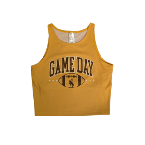 gold cropped tank top with design center chest. Arced brown game day with white outline with brown outlined football under. brown bucking horse within football