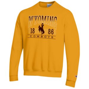 gold crewneck sweatshirt with design center chest. arced wyoming in white outline with top half filled with brown, bucking horse, 1886, cowboys under arc in brown