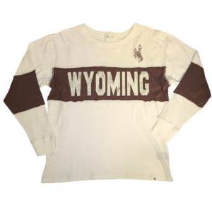 white oversized long sleeve tee. Brown block center chest with Wyoming in white in brown block. bucking horse left shoulder in brown