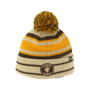 knit beanie with pom-pom on top. Beanie is tan with gold and brown stripes. cuff at bottom with small patch. patch is pistol pete