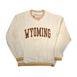 white crewneck with gold trim around waist, sleeves and neck. stitched design center chest, brown wyoming with gold trim. gold cowboys under