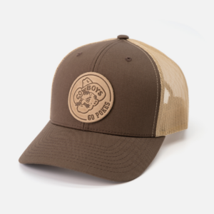 brown adjustable hat with two brown front panels and bill. khaki mesh backing. circle patch on front paneling. Patch is pistol pete with go pokes to the right