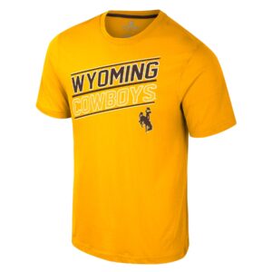 Gold short sleeve tee with slanted design on front chest. Wyoming in brown with white outline slanted from right to left with white outline cowboys under and brown bucking horse at bottom left