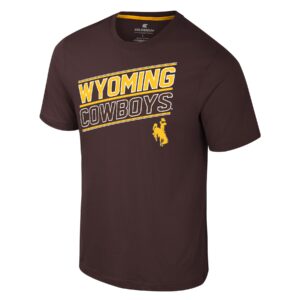 brown short sleeve tee with slanted design on front chest. Wyoming in gold with white outline slanted from right to left with white outline cowboys under and gold bucking horse at bottom left