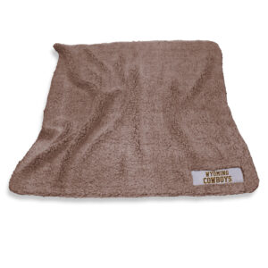brown fleece blanket with wyoming cowboys logo patch in the bottom right corner