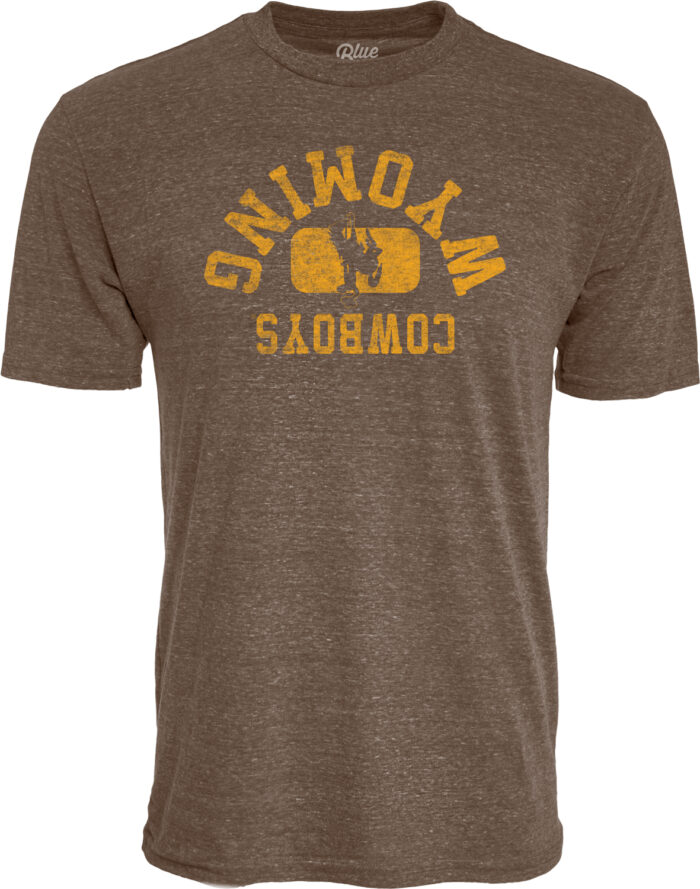 brown short sleeve t-shirt with design center chest. design is an upside down arched wyoming with bucking horse below and cowboys below that. Design is gold lettering