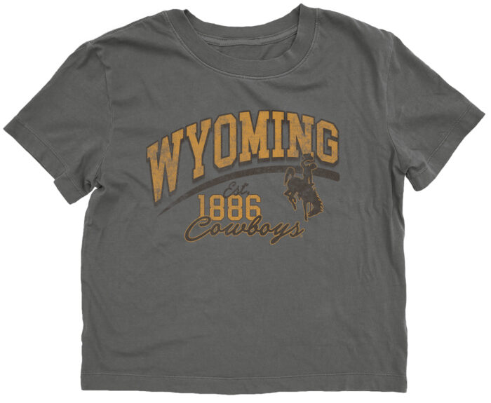 grey womens crop tee with gold and brown design centered. design is wyoming lettering with est. 1886 below and cowboys script below that with bucking horse left centered