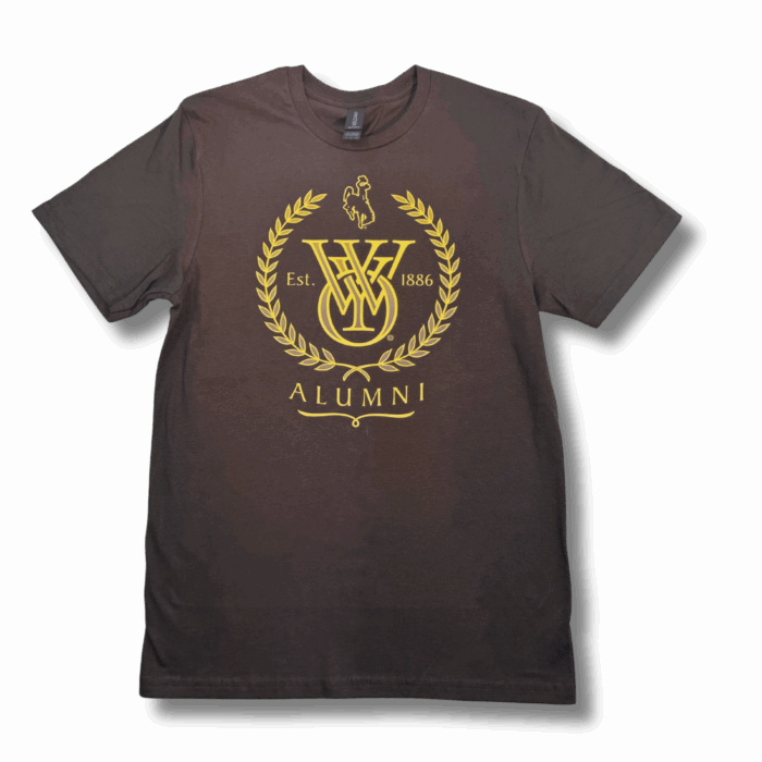 brown short sleeved tee shirt with gold design. design is University of Wyoming logo, laurel wreath, bucking horse, "Est. 1886," and "ALUMNI" text centered on the chest.