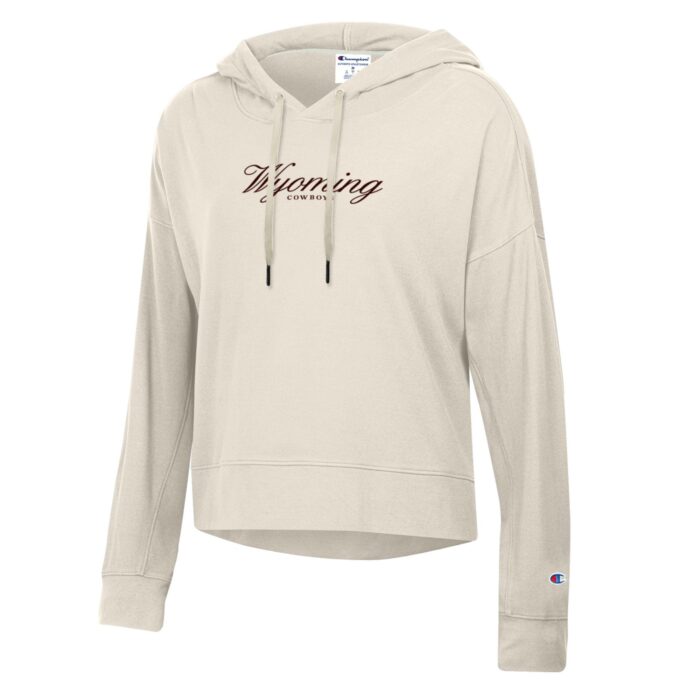 ivory women's champion sweatshirt with small brown design center chest. design is script wyoming with cowboys lettering below