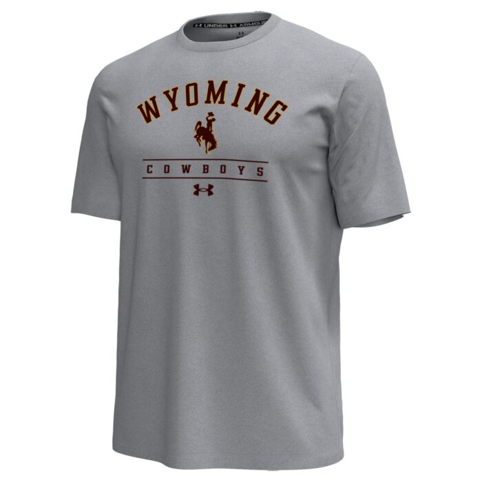 grey tee shirt with design center chest. design is arched wyoming with bucking horse and cowboys lettering below that with a brown under armour sign below that