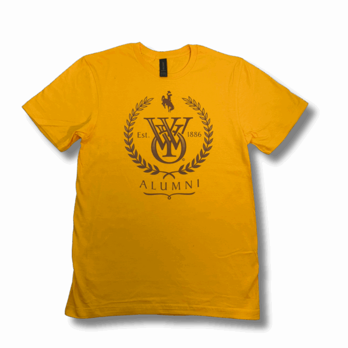 gold short sleeved tee shirt with brown design. design is University of Wyoming logo, laurel wreath, bucking horse, "Est. 1886," and "ALUMNI" text centered on the chest.