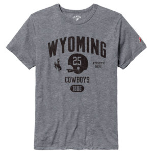 grey tee shirt with design center chest. black wyoming lettering with a bucking horse, football helmet with 25 and athletic dept. going horizontal. cowboys lettering on top of 1886