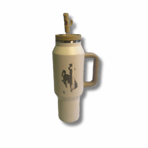 cream and tan 40oz. tumbler. fully insulated with a straw lid. top and handle are tan and cream body. etched bucking horse