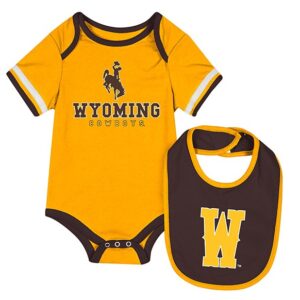 gold and brown infant onesie and bib. gold onesie with bucking horse and wyoming in gold. bib is brown with gold W