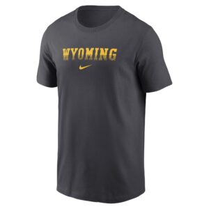 dark grey nike tee shirt with design center chest. design is gold wyoming lettering gradient. and has gold nike sign centered below