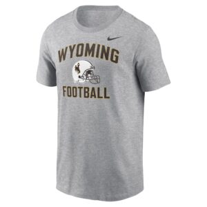 grey nike tee shirt with design center chest. design is arched wyoming in brown with white football helmet below. Has football wording below in brown and nike sign on top left of design