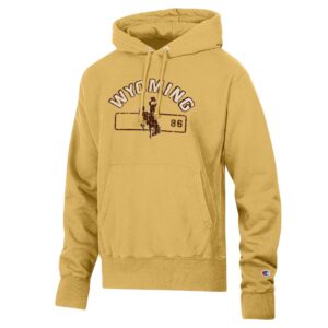 gold champion hooded sweatshirt with arched wyoming in white with brown box shadow. has bucking horse in brown below with 86 left centered