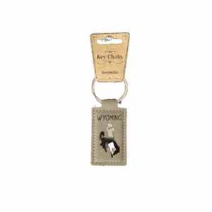 tan leather keychain with wyoming and bucking horse on leather. wyoming screen-printed and bucking horse is a metal patcj