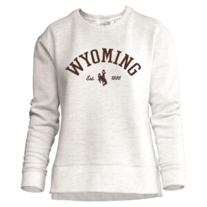 oatmeal women's crewneck with brown design center chest. design is arched wyoming lettering with est. bucking horse 1886 below going left to right