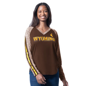 brown women's long sleeve with tan sleeves with stripes on back of sleeves. has wyoming lettering on front chest in gold with bucking horse left centered above