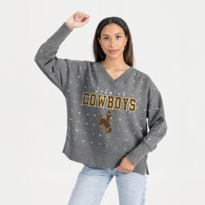 women's oversized grey v-neck crewneck with rhinestones all over. has wyoming lettering above cowboys and bucking horse all center chest