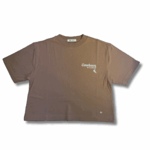 tan cropped tee with small white design on top left chest. design is cowboys lettering above wyoming. all above bucking horse