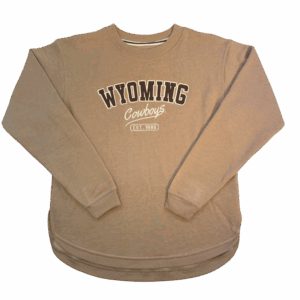 tan women's crewneck with design center chest. design is brown wyoming lettering with white outline. has script cowboys lettering below and white est 1886 below that.