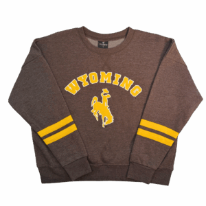 brown women's crewneck with embroidered design center chest. design is gold arch wyoming lettering over a bucking horse with white outline. has two gold stripes on wrist of sleeves