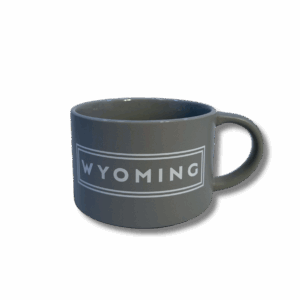 grey soup mug with handle. has white lettering that says wyoming with two white lines outlining the lettering in a rectangle shape