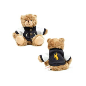 brown plush hear weating a black and white varsity button up jacket. sits up and back of jacket has gold bucking horse