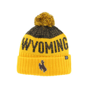 gold beanie with brown and gold pom on top. top section is brown with gold below. has brown wyoming lettering in gold section with brown bucking horse embroidered on gold cuff