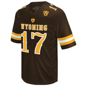 brown football jersey. Word Wyoming and number 17 on front in gold with white outline. has commemorative patch on left chest
