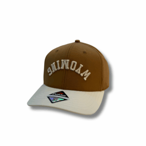 camel and cream hat with wyoming lettering on the front panel in cream