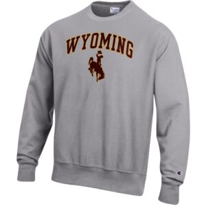 grey champion reverse weave crewneck with design center chest. design is arch wyoming lettering in brown with gold outline and bucking horse below in brown